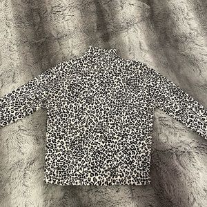 Brandy Melville blue and black cheetah print mock neck shirt